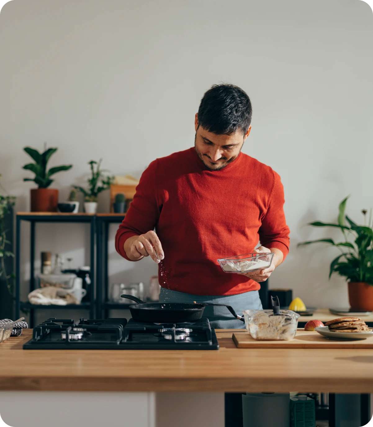 Man cooking in a modern kitchen.